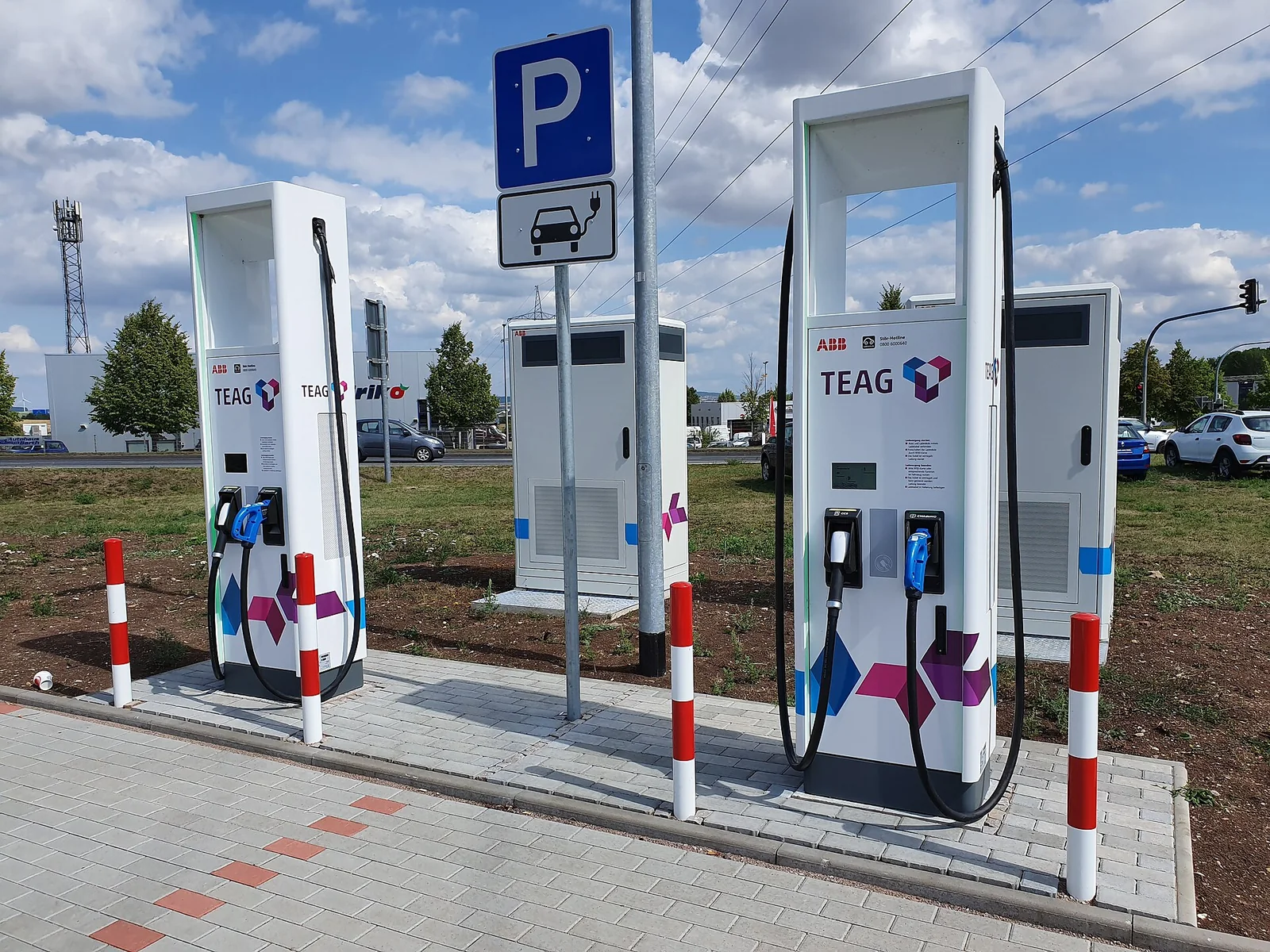 Two ABB Terra HP charge posts with external power equipment at a charging site in Thörey, Germany