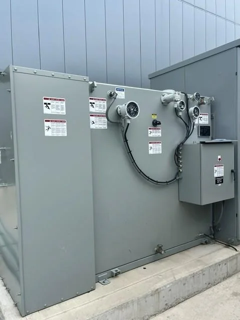 Transformer tank with gauges, controls and side enclosures