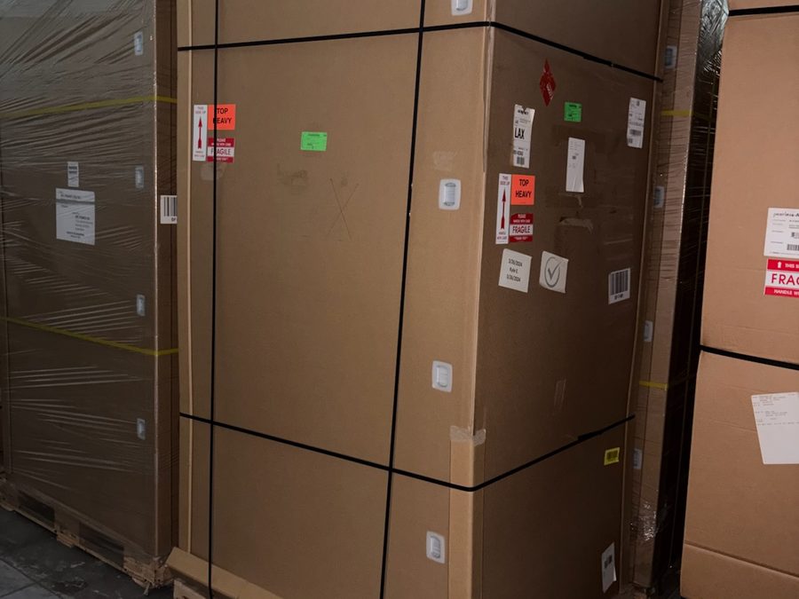 Factory-strapped crate holding a BTC Power 360 kW power cabinet in indoor storage