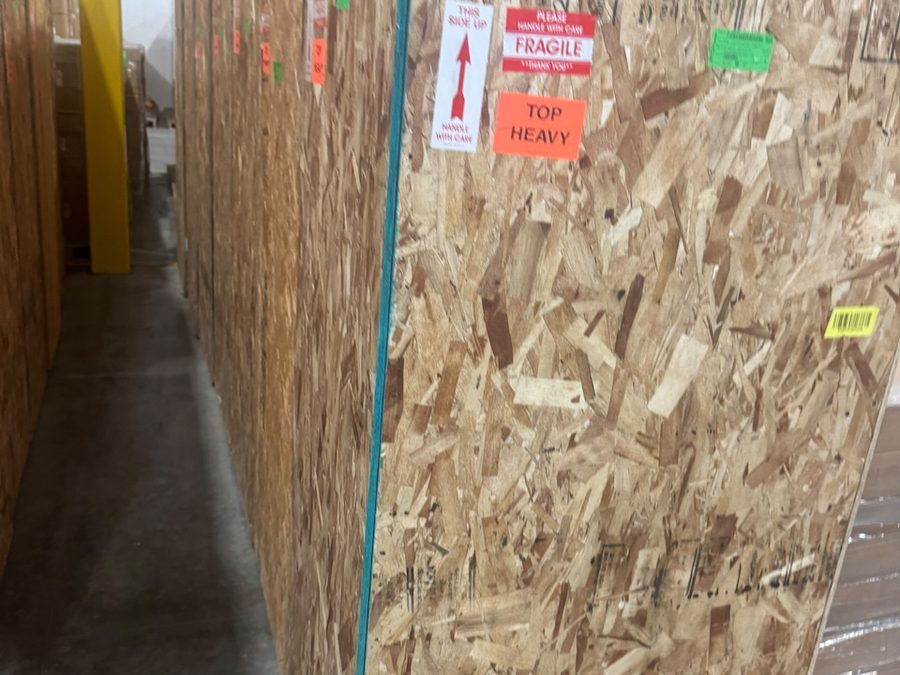 Rows of factory-crated Volta stations in indoor storage
