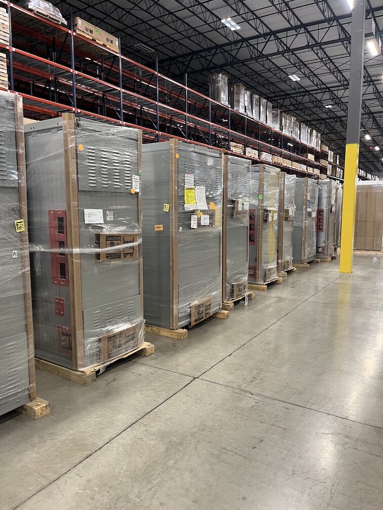 Rows of wrapped electrical distribution equipment from a canceled project