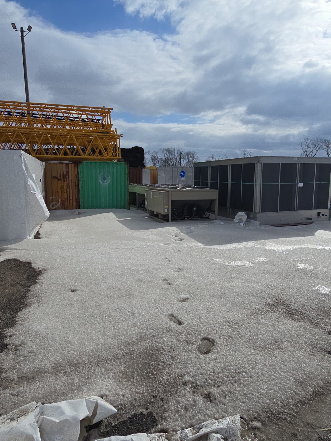 Daikin condensing units photographed in snow-covered outdoor storage