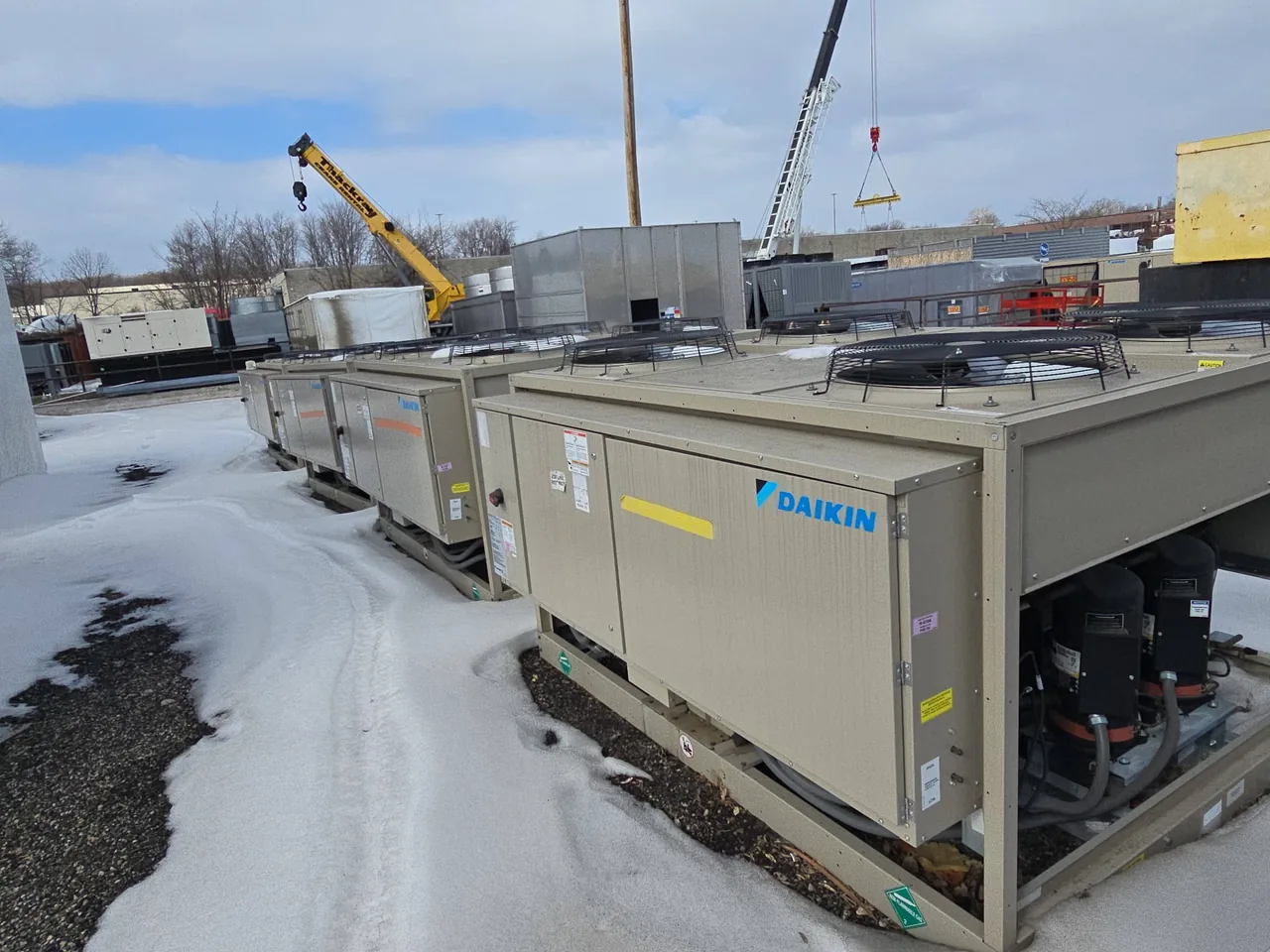 Rows of Daikin RCS040D condensing units photographed in outdoor storage