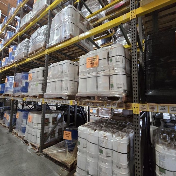 Racked pallets of professional liquid plant nutrients in California warehouse